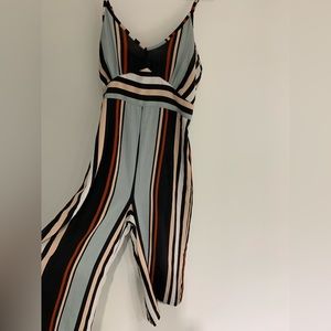 Stripped romper with adjustable straps.